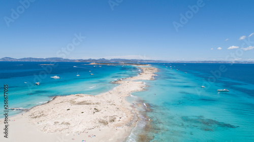 illetas, formentera beach seen from drone with turquoise and crystalline sea and Ibiza in the background