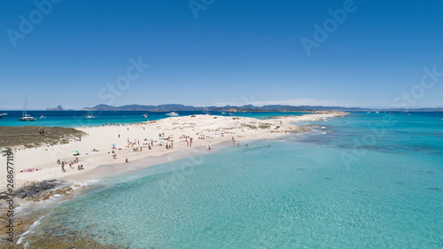 illetas, formentera beach seen from drone with turquoise and crystalline sea and Ibiza in the background