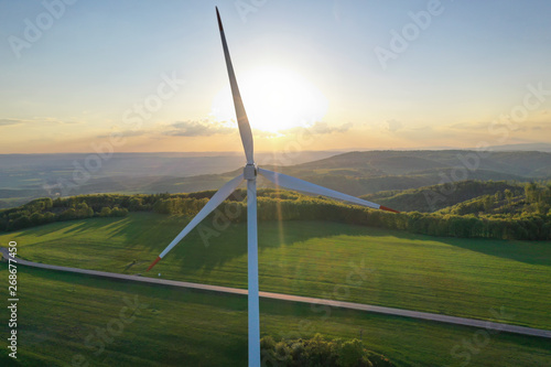 Wind turbines at sunset taken from the drone
