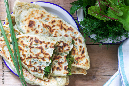 Baker making traditional dish of Armenians from Artsakh Zhingyalov hats is a type of flatbread stuffed with herbs.