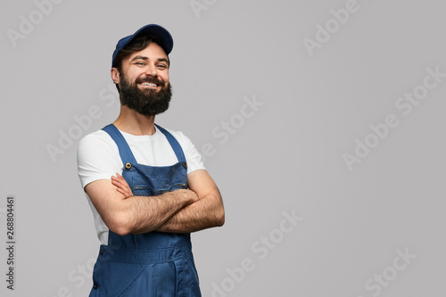 Confident locksmith looking at camera