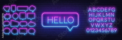 Neon sign of word hello in speech bubble frame on dark background.Set of neon speech bubbles and the alphabet on a dark background. Template for design.