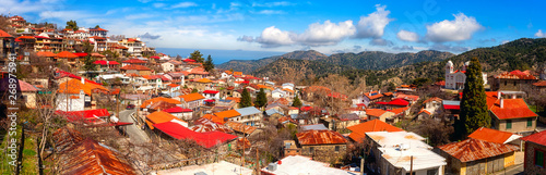 Pedoulas cozy village in Troodos mountains, Cyprus, panoramic view. Scenic cityscape with tiled roofs and blue sky, Marathasa valley, Lefkosia (Nicosia) district