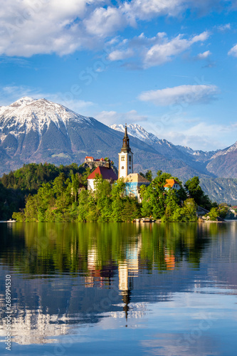 Church on island reflected in waters of Bled Lake