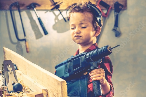 Child fathers day concept, carpenter tool, worker.