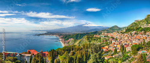 Aquamarine blue waters of sea near Taormina resorts and Etna volcano mount