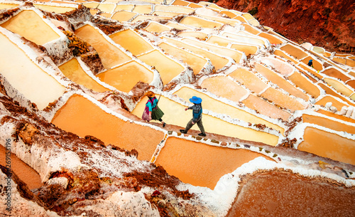 Workers at Salinas de Maras near Cusco, salt extraction in Peru