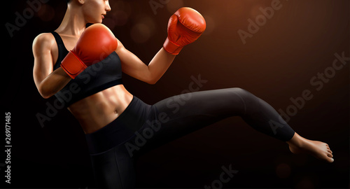 Female boxer kicks high