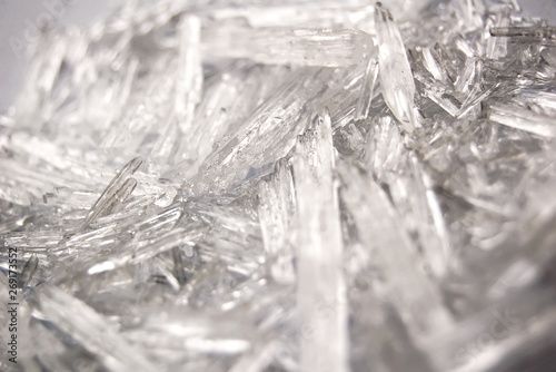 Macro background of natural menthol crystals, made of mint ingredient. Ice, winter and cold concept.