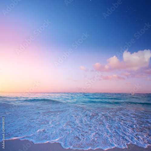 Art Beautiful sunrise over the tropical beach; paradise summer vacation