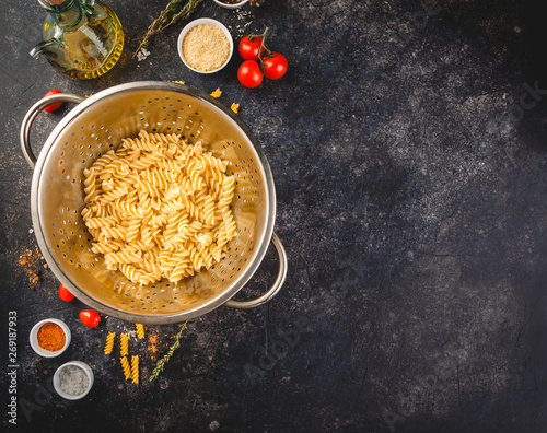 Fusilli pasta in a stainless steel colander