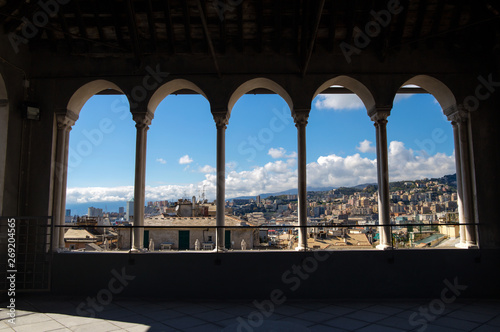 City of Genoa through the colonnade of the Saint Lawrence (San Lorenzo) Cathedral, Genoa, Italy.