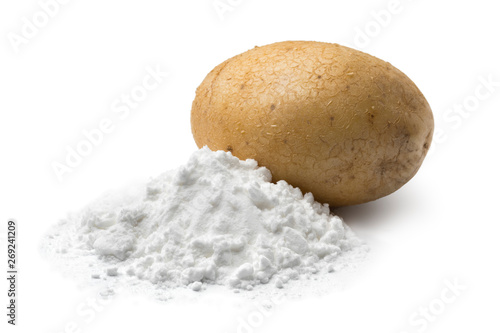  Heap of potato starch and a fresh potato