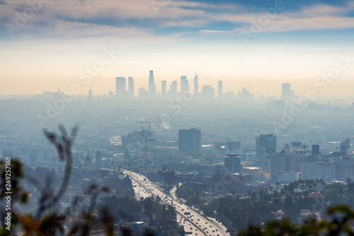 LOS ANGELES, CALIFORNIA - FEB 13: Sunrise towards a smog ridden Los Angeles downtown. LA is well known for its Hollywood film district.