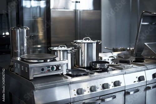 Work surface and kitchen equipment in professional kitchen, view counter in stainless steel.