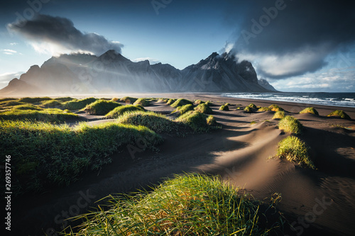 Unique view on the green hills with sand dunes. Location Stokksnes cape, Vestrahorn, Iceland.