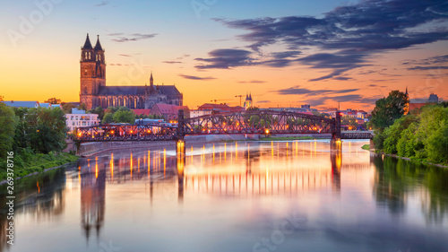 Magdeburg, Germany. Cityscape image of Magdeburg, Germany with reflection of the city in the Elbe river, during sunset.