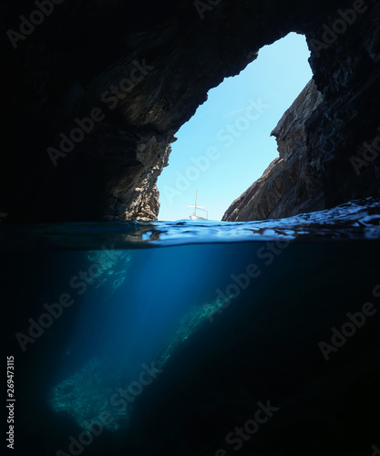 Over and under water inside a large cave on the sea shore, Spain, Mediterranean, Costa Brava, Cap de Creus, Cueva del infierno, Catalonia