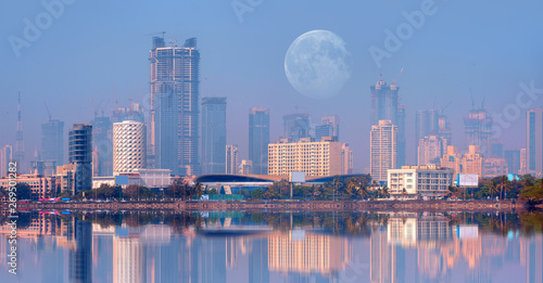 Mumbai is the financial and entertainment capital of India - Construction crane and skyscraper at sunset "Elements of this image furnished by NASA"