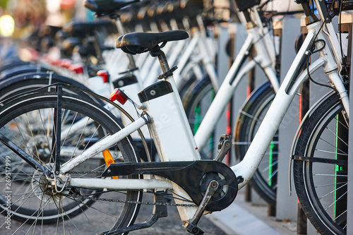 Charging urban electric battery bikes in the city. Eco transport