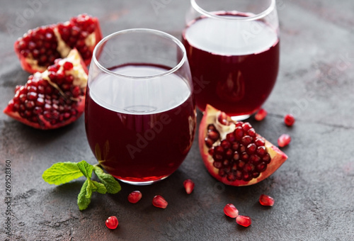 Pomegranate juice with fresh pomegranate fruits