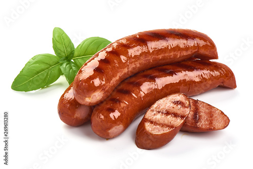 Grilled bratwurst Pork Sausages with basil leaves, close-up, isolated on white background