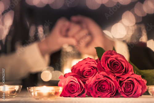 Couple enjoying a candle light dinner, Romantic date night, engagement dinner.