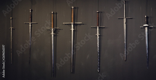 a two-handed sword. The battlefield, after the battle. Crusade, medieval weapons. Lost, forgotten sword, fallen warrior. 