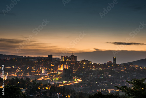 Kigali city centre skyline and surrounding areas lit up at dusk. Rwanda