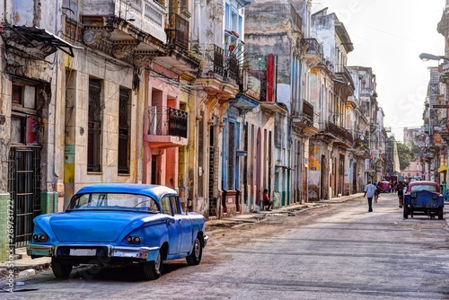 Rear view of the old blue car parked on the street in Havana Vieja, Cuba