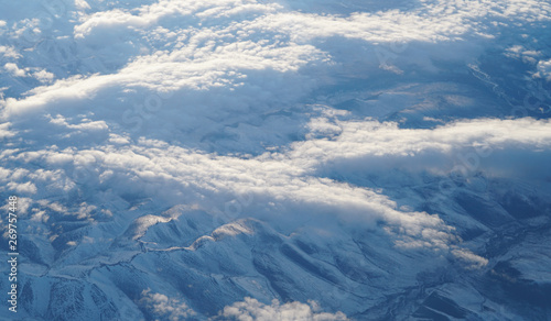 aerial view of snow mountains range from airplane