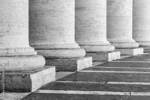 Row of white travertine columns. Colonnade of St Peters Square in Vatican City
