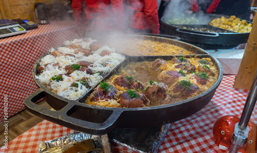 Roasted smoked pork legs and stew cabbage at Wroclaw christmas market