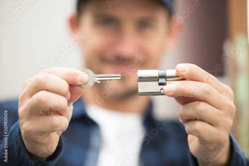 closeup locksmith fix a wood lock