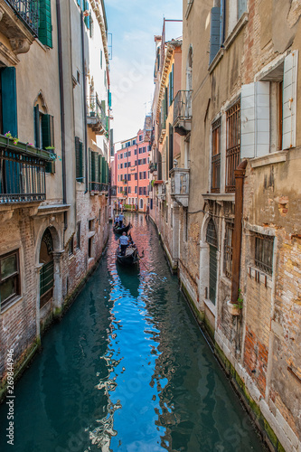 Venice, city of Italy. View of the canal, the Venetian landscape with boats and gondolas