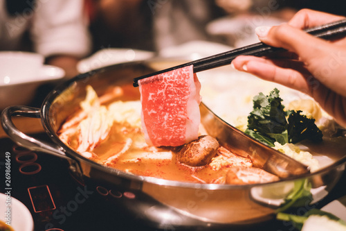 Ma La Hotpot, Spicy Chinese hot pot with beef, tofu, prawns, mushrooms, green leaves and noodles.