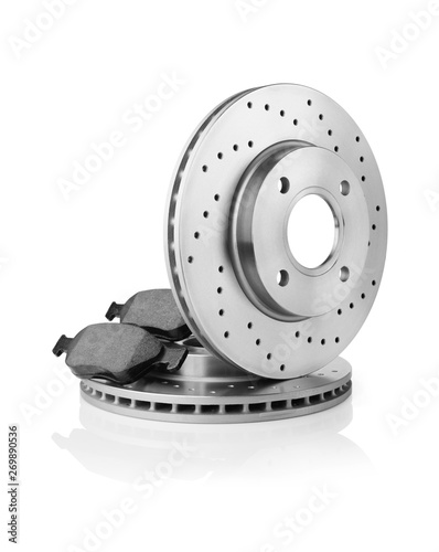 Brake discs and brake pads on white background