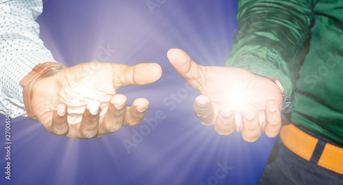 Two business men black hands as if holding light ray. Focus on finger tips. Image