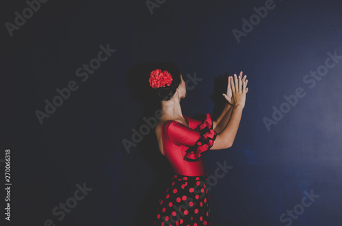 woman in red dress dancing spanish flamenco