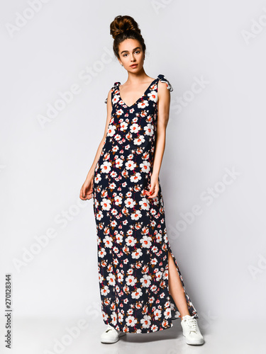 Woman in Long Floral Dress in Fashion Store - Portrait of girl in a clothes shop in a maxi summer dress