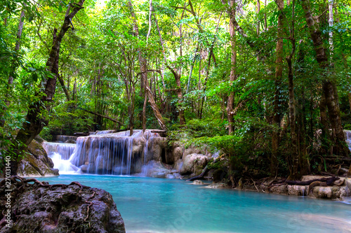 Erawan Waterfall idyllic in green forest and is rain forest