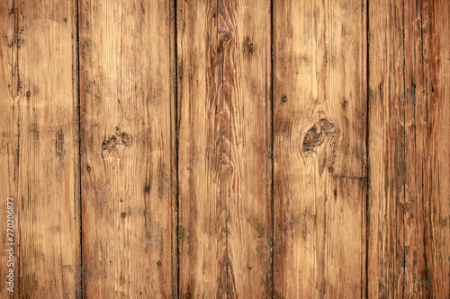 Shabby wooden wall background. Texture of obsolete carpentry wooden boards, panel. Vintage dirty wood floor. Old wooden plank grunge texture. Weathered oaky fence, oaken table, timber. Hardwood brown 