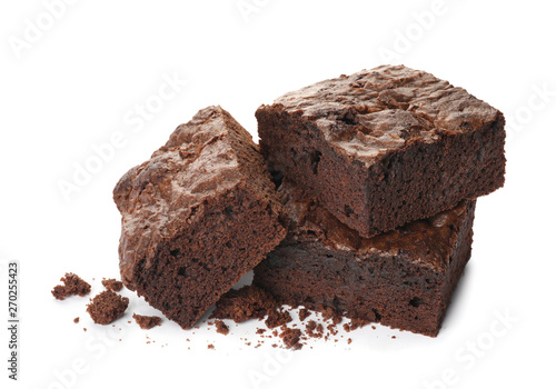 Pieces of fresh brownie on white background. Delicious chocolate pie