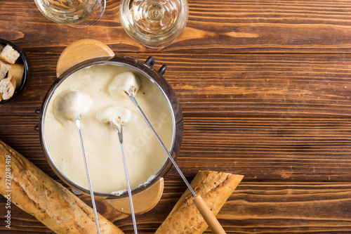 Cheese fondue with bread wine and grape