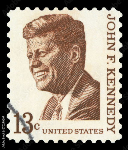 UNITED STATES OF AMERICA - CIRCA 1967: A used postage stamp printed in United States shows a portrait of the President John Fitzgerald Kennedy in brown, circa 1967.