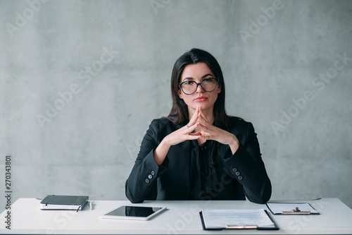 Leadership and successful career. Portrait of powerful business woman in eyeglasses, with confident facial expression.