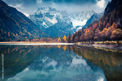 Dramatic autumn view of Braies Lake. Colorful morning scene of Italian Alps, Naturpark Fanes-Sennes-Prags, Dolomite, Italy, Europe. Beauty of nature concept background.