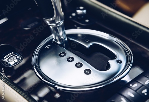 Automatic gearbox shift lever in luxury car.