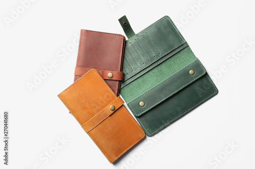 Stylish wallets on white background, top view
