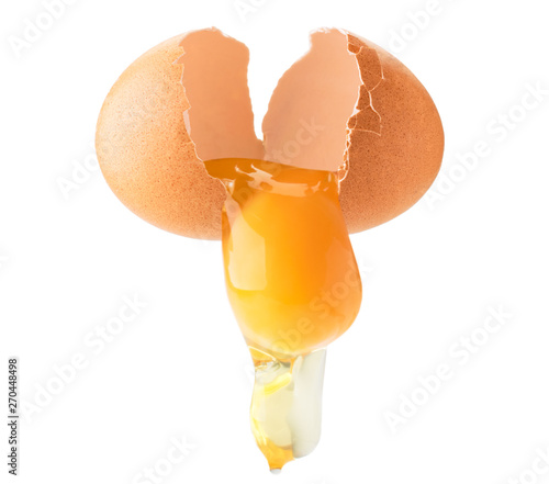 Chicken egg broken in half, follows yolk and protein on a white, isolated.